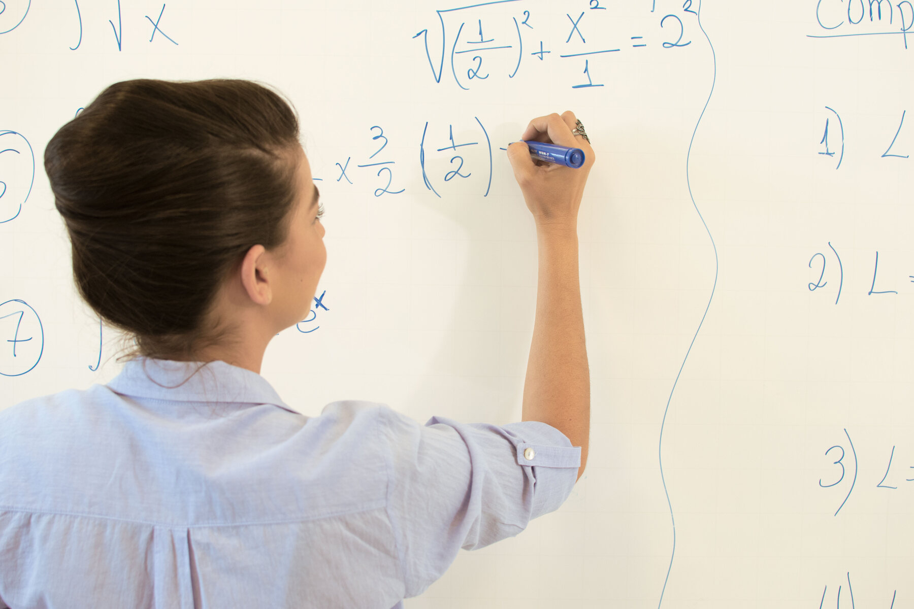 Maths teacher on a whiteboard